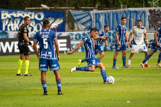 referee discussing with players