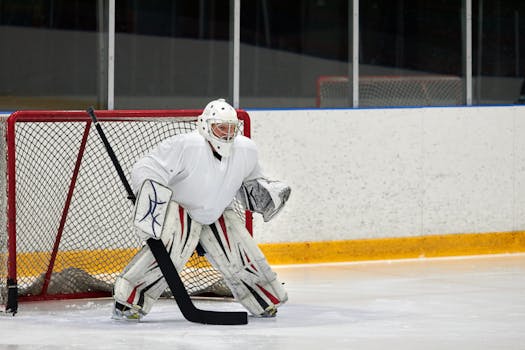 A goalkeeper directing his defense during a match