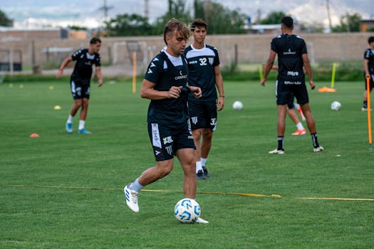 players warming up on a soccer field