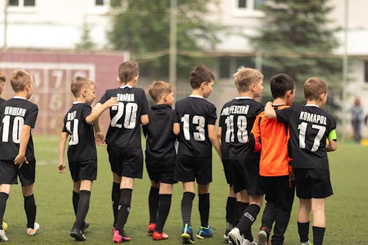 young soccer players celebrating