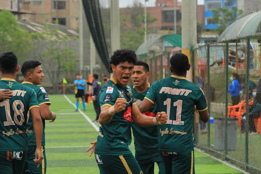 young players celebrating a goal