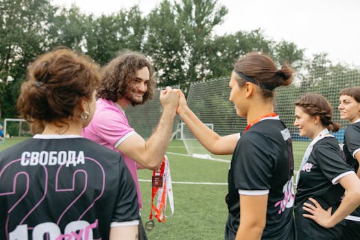 Soccer players celebrating an assist