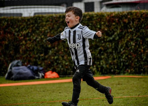 kids celebrating a soccer goal