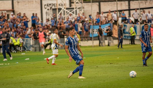 A soccer match in a crowded stadium