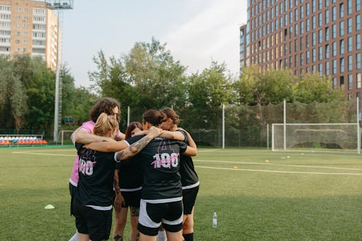 Soccer team huddling before a match