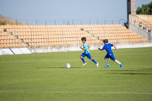 young kids playing soccer