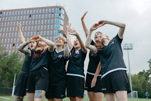 youth soccer team celebrating a goal