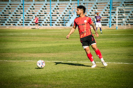 soccer player doing a cartwheel celebration