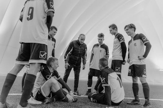 youth soccer coach working with players